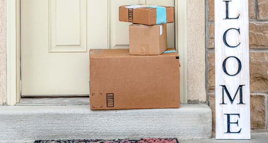 Deliveries on the front porch of a house with a welcome sign in Madison